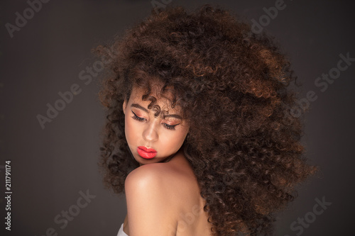 Beauty portrait of attractive woman in afro hairstyle.