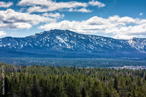 Mountains, forest and clouds