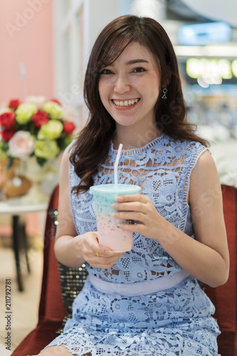 woman drinking a cup of milk at cafe