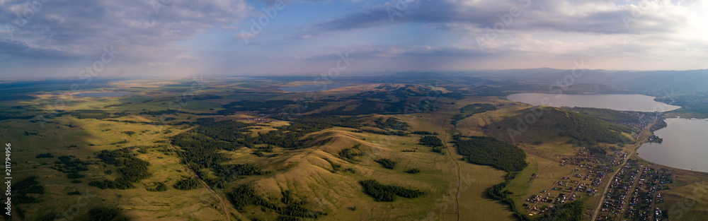 Panoramic view from drone of the fields near mountains