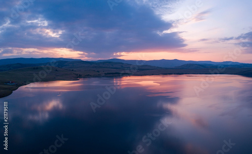 Beautiful panoramic view of the Lake on the sunset and hills on the background © Maria Shaytor