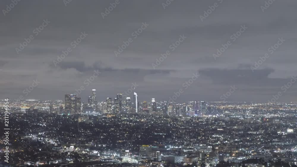 Night overview of Los Angeles Downtown from Griffith Observatory - tilting movement, long lens Night overview of Los Angeles Downtown from Griffith Observatory - tilting movement, long lens
