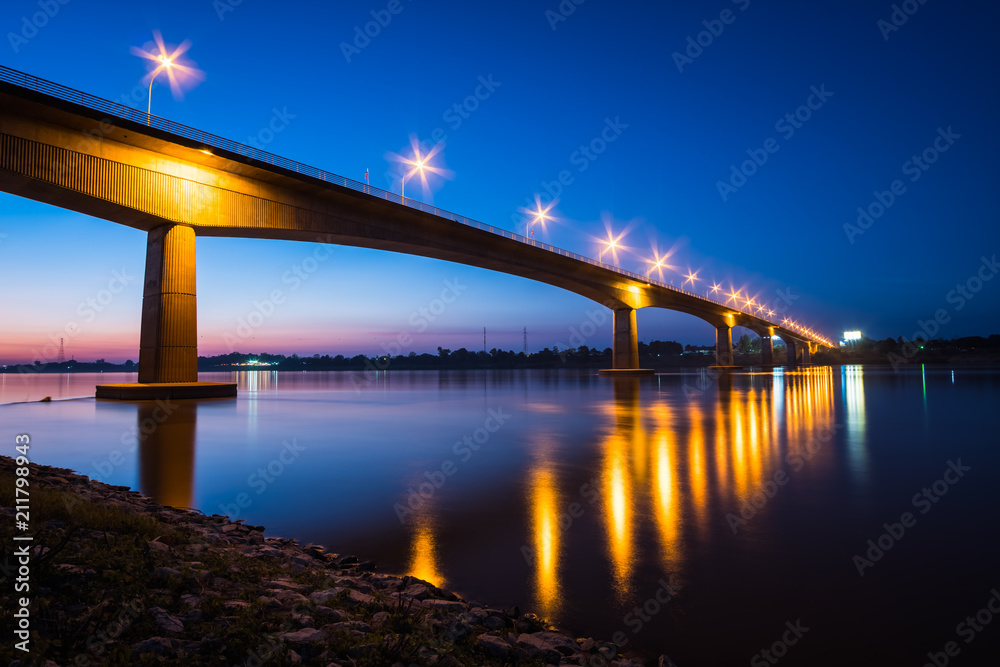 Thai-Laos Friendship Bridge on sunset background