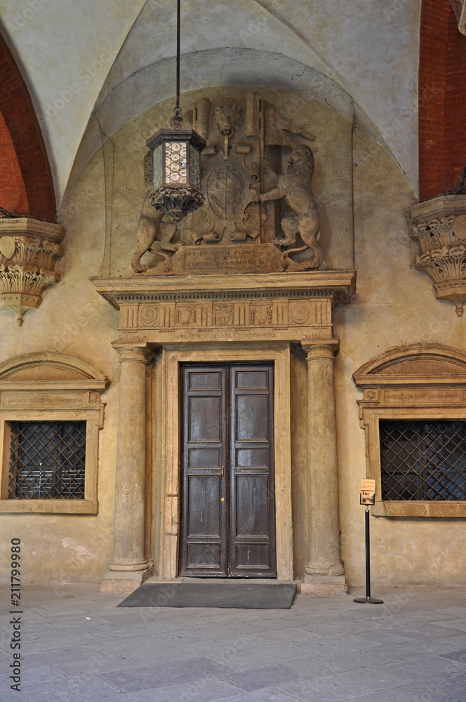 Italy, Bologna old medieval building door in Accursio palace interior. 