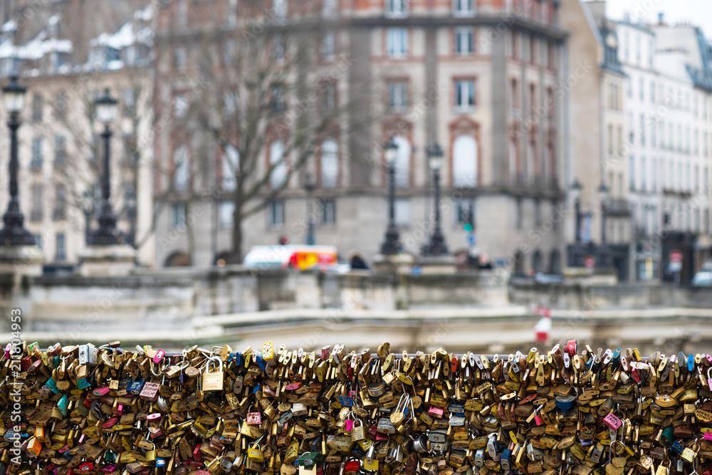 Obraz premium Love padlocks at Pont de l'Archeveche in Paris. The thousands of locks of loving couples symbolize love forever.