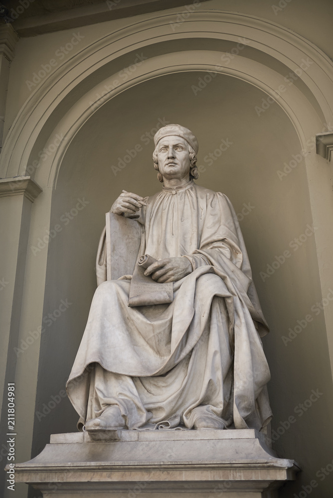 Firenze, Italy - June 21, 2018 : Arnolfo di Cambio statue in Palazzo dei Canonici