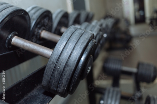 Rows of dumbbells in the gym. gym equipment for strength training