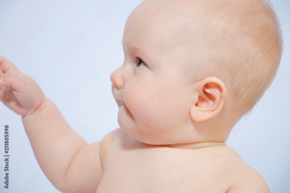 Close-up portrait of a beautiful baby in profile