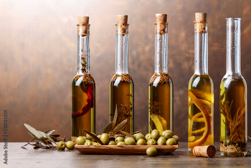 Obraz premium Green olives and bottles of olive oil .
