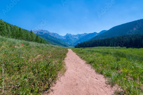 Sunny day in the mountains with hiking trail