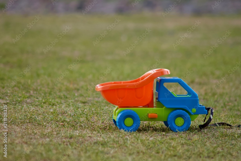 Fototapeta premium Toy car on the grass