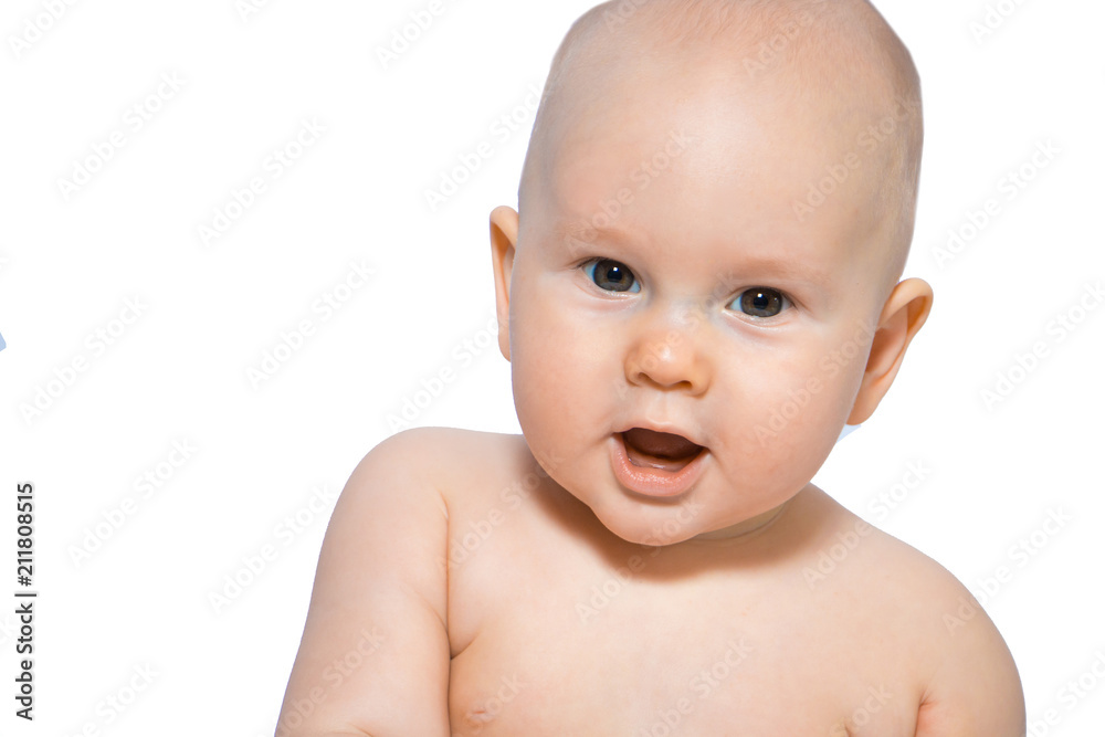 Beautiful close-up portrait of a happy baby on a uniform background Beautiful close-up portrait of a happy baby on a uniform background