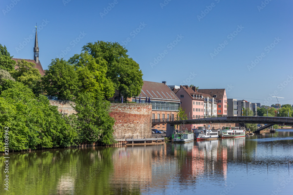 Colorful buildings and ships at the Fulda river quay in Kassel, Germany