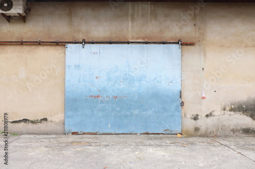 old metal door of big warehouse in Thailand