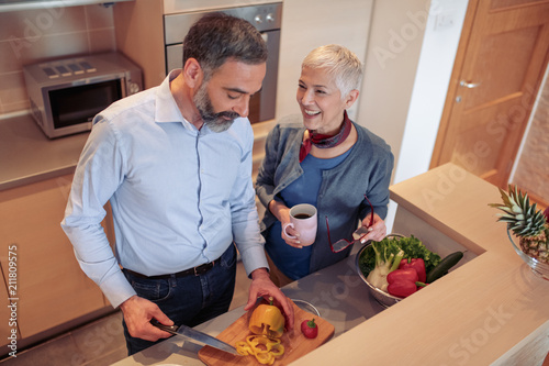 Happy mature couple in kitchen
