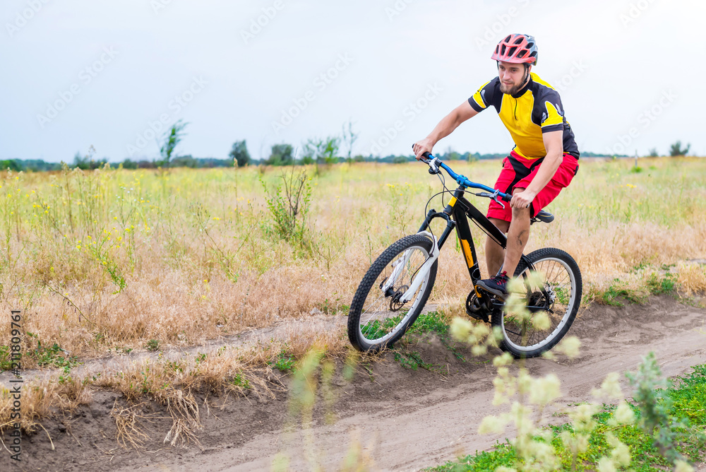 Concept of an active lifestyle, a cyclist riding a bicycle, free space. Concept of an active lifestyle, a cyclist riding a bicycle, free space.