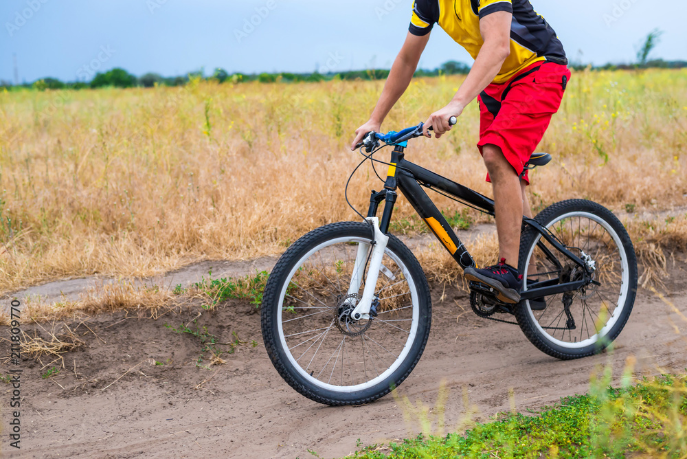Concept of an active lifestyle, a cyclist riding a bicycle, free space. Concept of an active lifestyle, a cyclist riding a bicycle, free space.