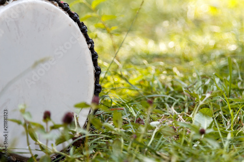 african djembe drum on the grass. close-up african musical drum instrument