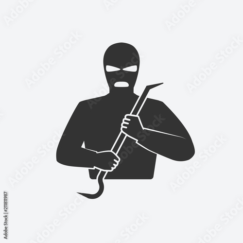 burglar in mask with crowbar photo