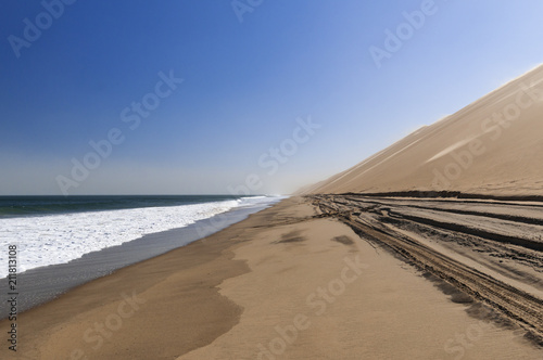 Fototapeta Naklejka Na Ścianę i Meble -  Dunes on the Skeleton Coast / Sandstorm on the Skeleton Coast, dunes to the Atlantic Ocean, Namib Desert, Namibia, Africa.