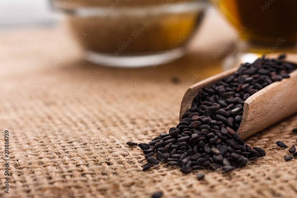 fresh sesame seeds on a rustic background fresh sesame seeds on a rustic background