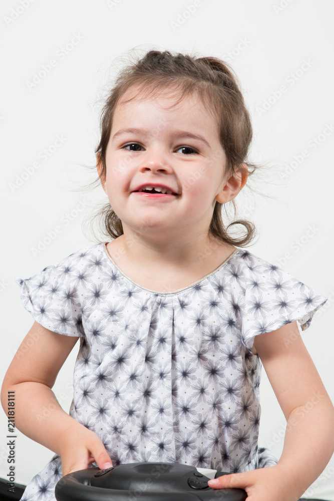 Portrait of smiling adorable brunette child girl in dress Portrait of smiling adorable brunette child girl in dress
