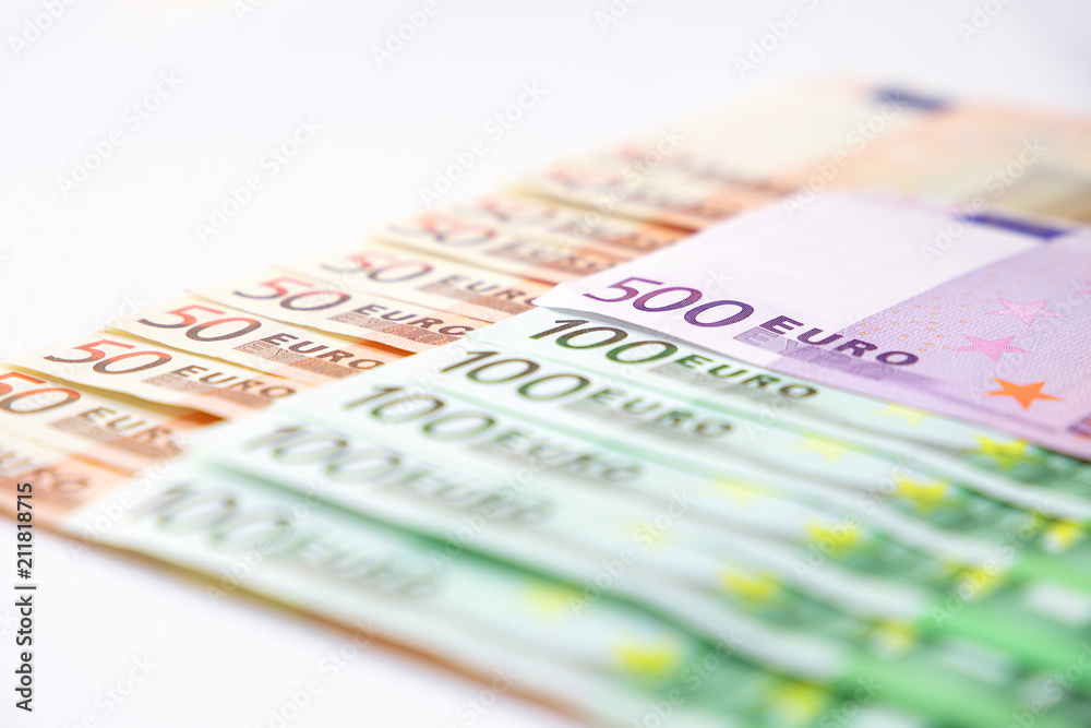 Euro banknotes close up. Several hundred euro banknotes on white background Euro banknotes close up. Several hundred euro banknotes on white background