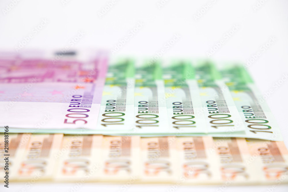 Euro banknotes close up. Several hundred euro banknotes on white background Euro banknotes close up. Several hundred euro banknotes on white background