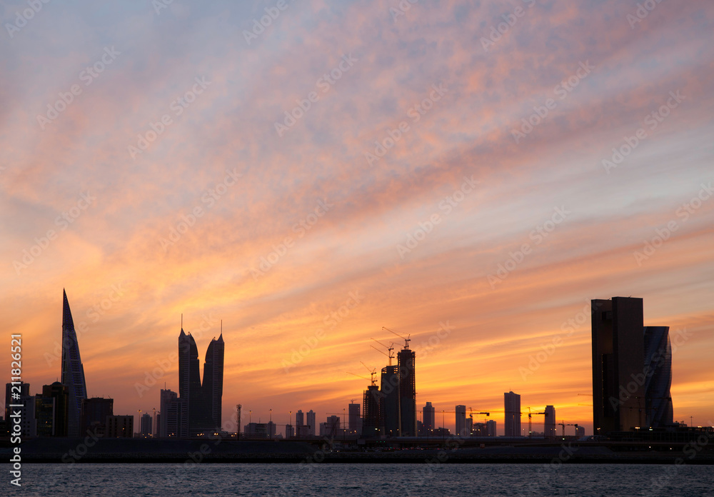 Dramatic sky and Bahrain skyline during sunset