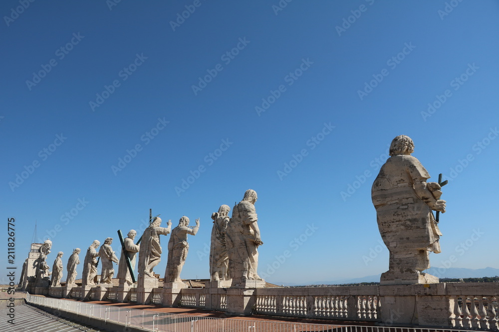 Holy statues on the roof of St. Peter's Basilica in the Vatican in Rome, Italy