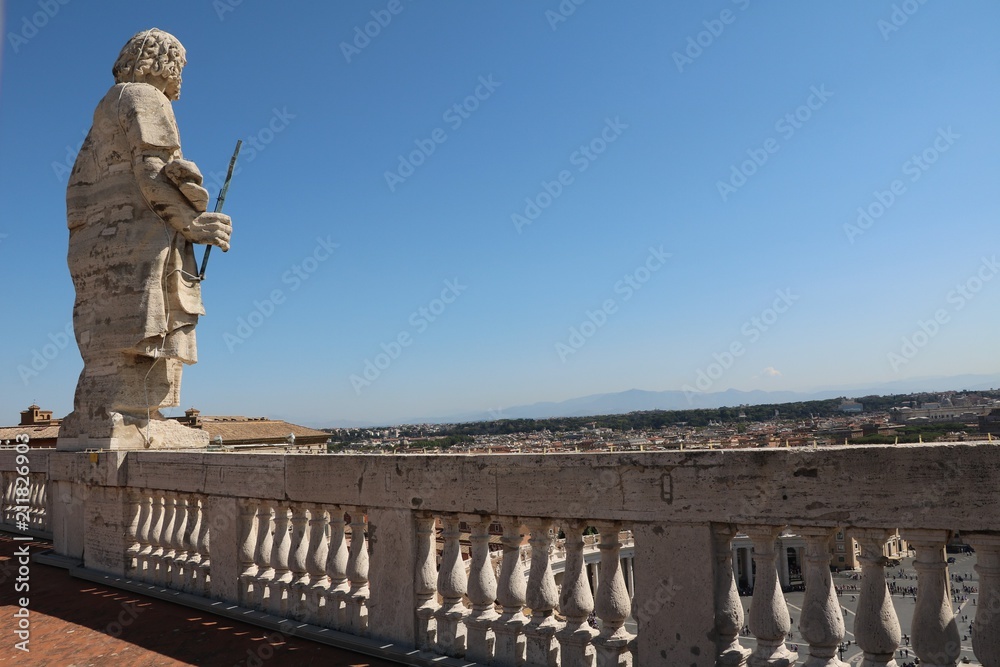 Holy statue on the roof of St. Peter's Basilica in the Vatican in Rome, Italy