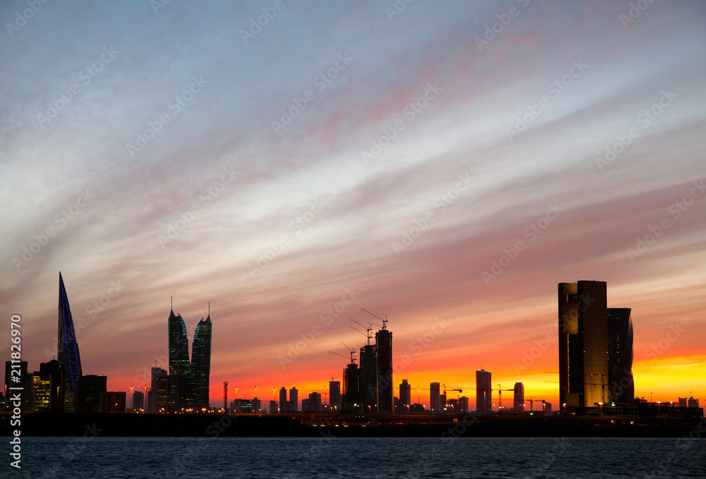 Dramatic sky and Bahrain skyline during sunset