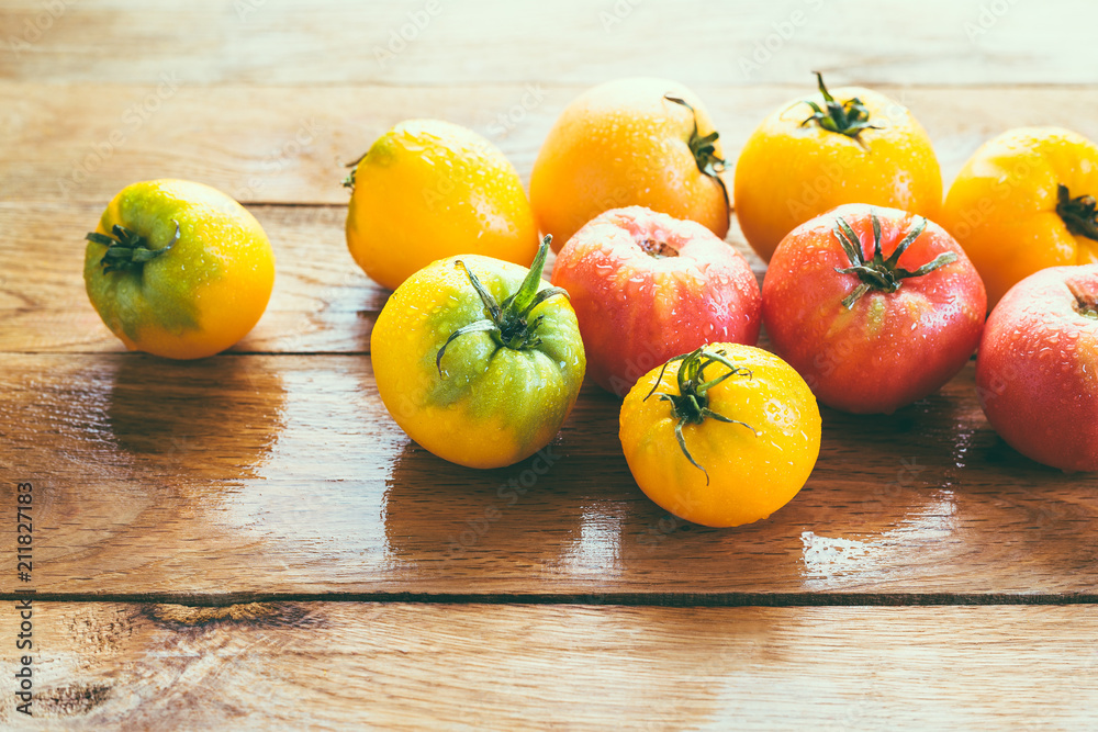 Yellow And Red Tomatoes On A Wooden Table
