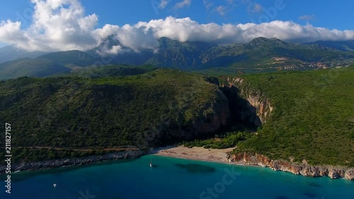 Summer Ionian Sea Aerial. coastline view with sandy beach on the sunset with green bushes in front, Albania dhermi gjipe beach.