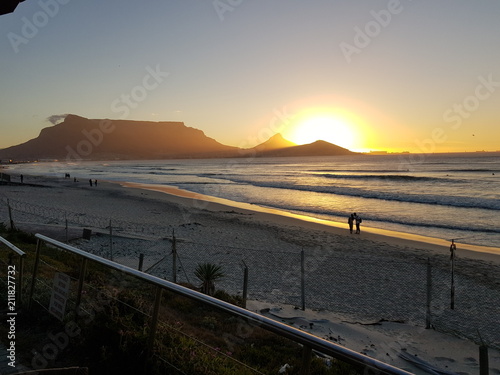 Sunset in capetown .The ocean in the background and the beaitifull Table mountain looking at us .