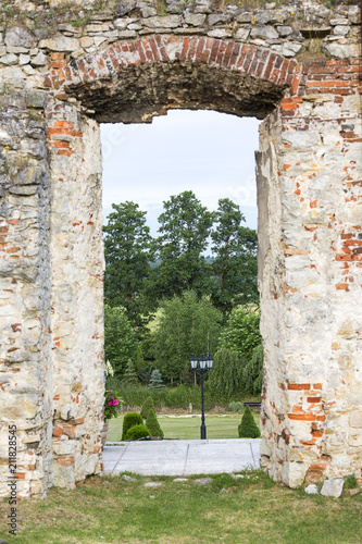 Ruins of 18th century classical palace, manor complex, situated on the Nida River near Jedrzejow, Sobkow, Poland photo