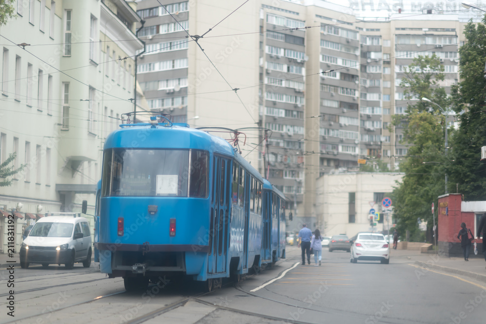 a blue tram ride down the Street in Moscow