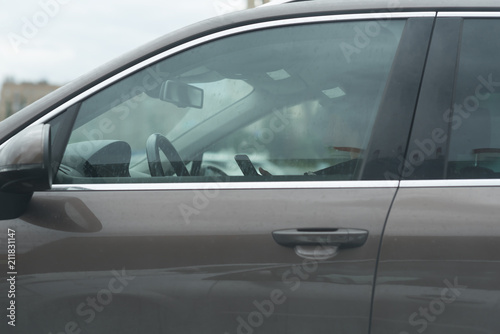 woman driver use her cell phone driving car © Mak