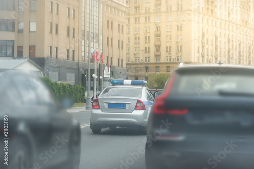 Patrol police car on the street in Moscow on a sunny day © Mak