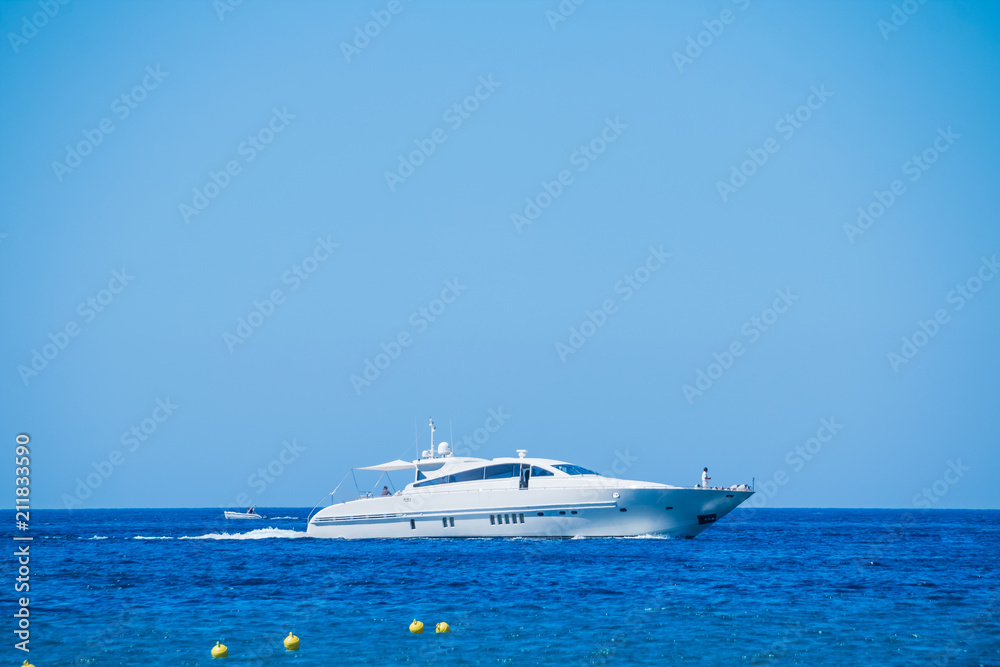 Side view of sail boat cruising in blue sea.Sailboat in the sea, active vacation in Mediterranean sea, Sea Luxury Yacht in the Mediterranean sea .Yacht in sunny summer day