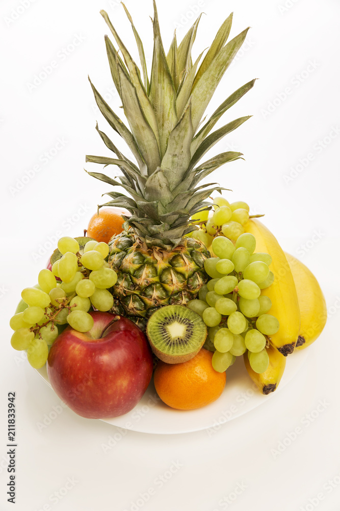 Fruit plate with fresh whole fruits, isolated on white background Fruit plate with fresh whole fruits, isolated on white background