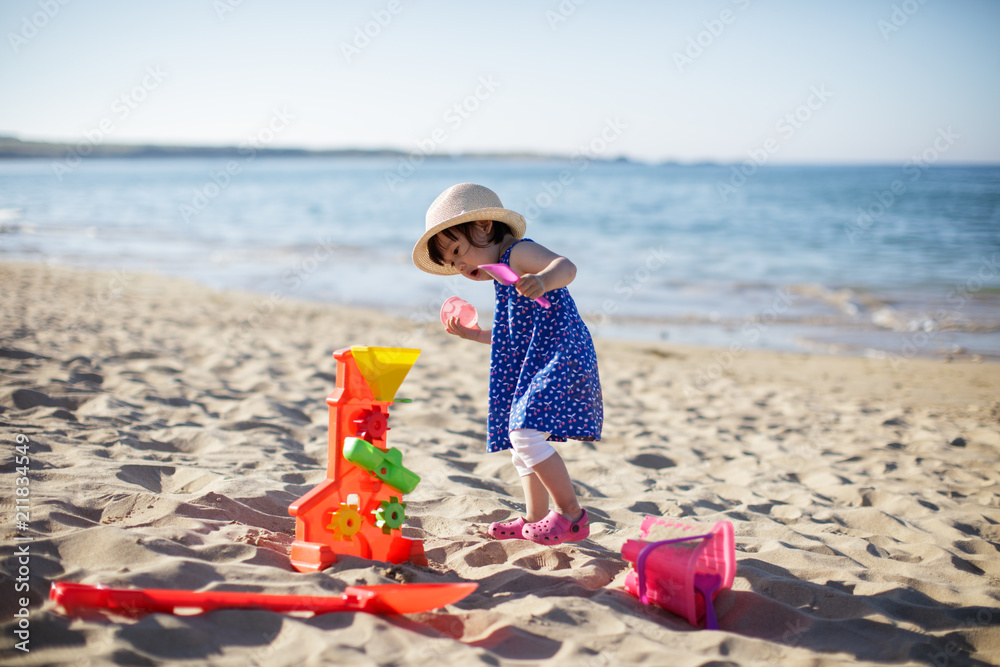 baby girl playing at summer beach baby girl playing at summer beach