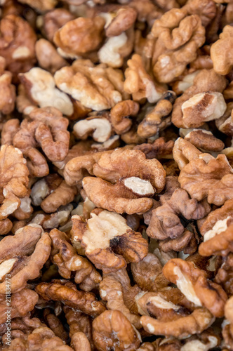 Fresh peeled walnuts at street market. Walnut kernel. Organic food concept