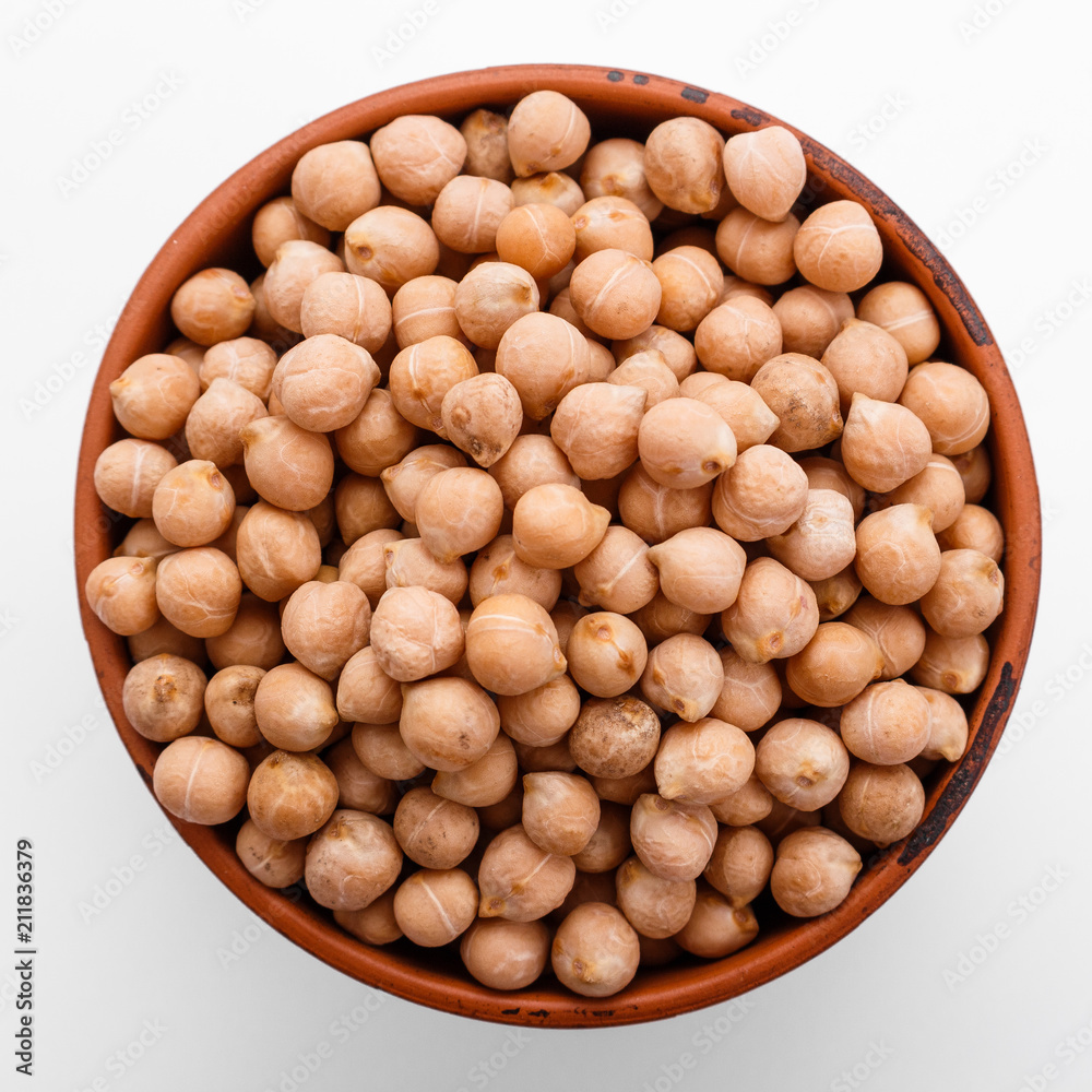 uncooked chickpeas on a white acrylic background uncooked chickpeas on a white acrylic background