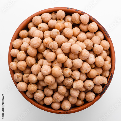uncooked chickpeas on a white acrylic background