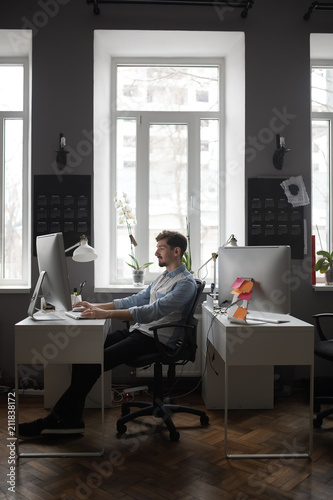A man working in a modern design office 