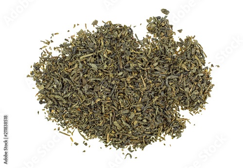 Dried green tea leaves on a white background, top view.