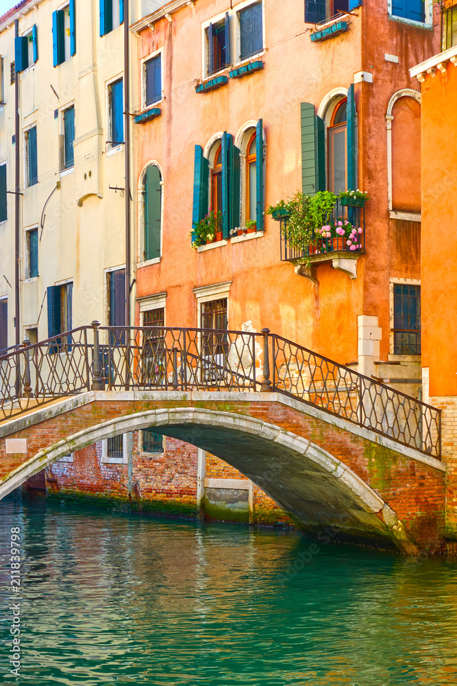 Bridge and old houses by canal in Venice