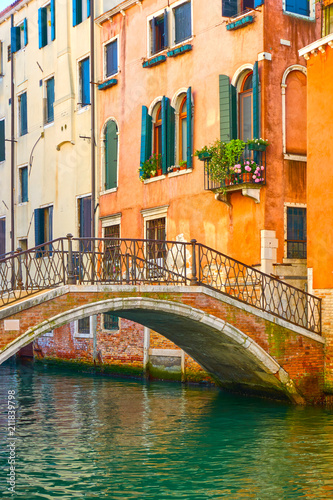 Bridge and old houses by canal in Venice