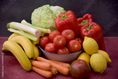 still life with tomatoes  peppers  lemons  carrots and lettuce